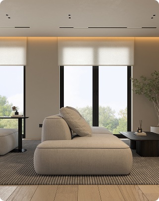 Living area with short beige roller shades framing a garden view, featuring stylish window treatments Miami homeowners use to enhance comfort and natural light.