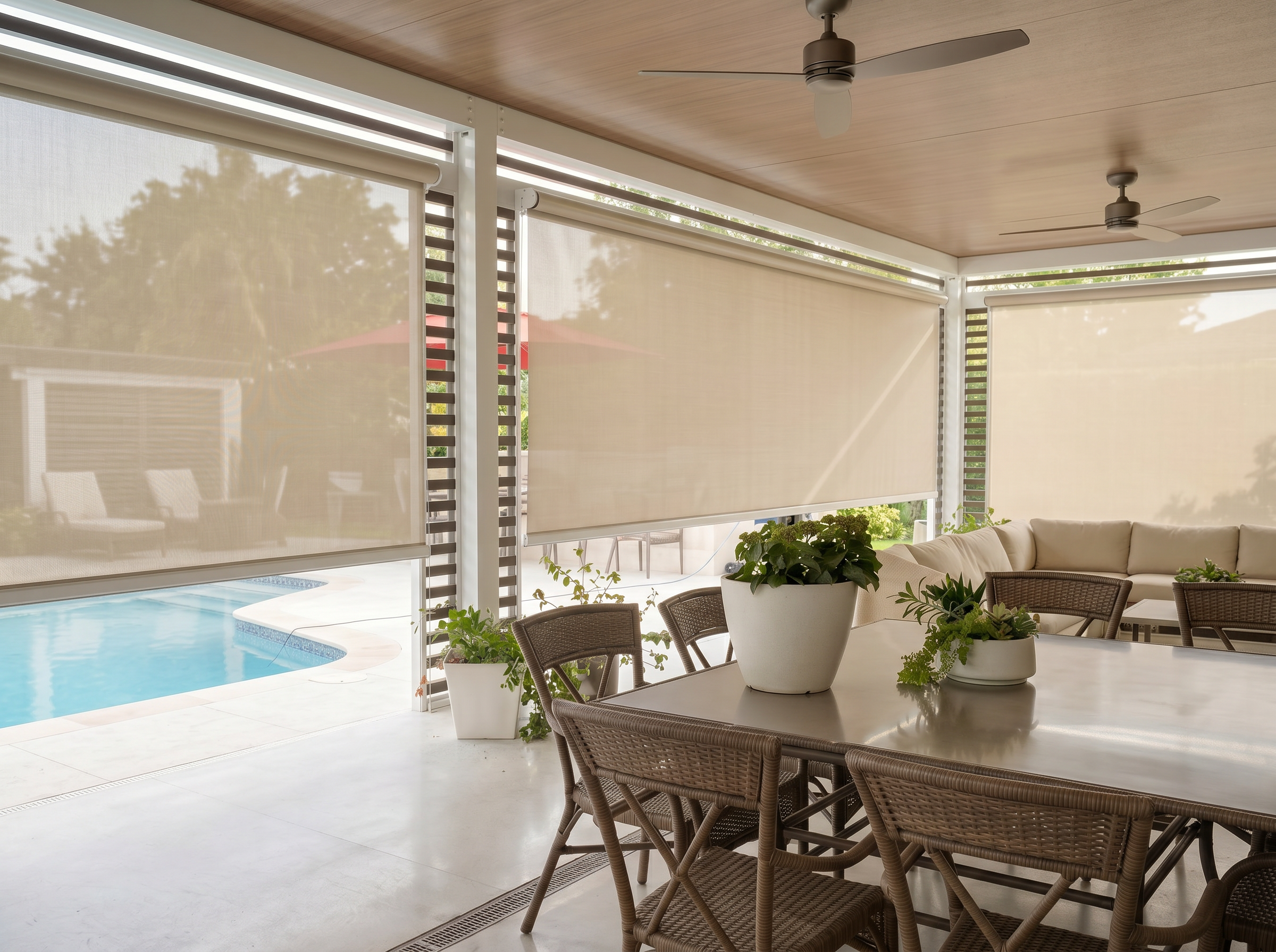 Covered outdoor patio with window treatments Miami homeowners choose for shade, privacy, and UV protection around a backyard pool and dining area.